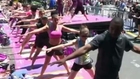 Thousands do yoga in New York's Times Square
